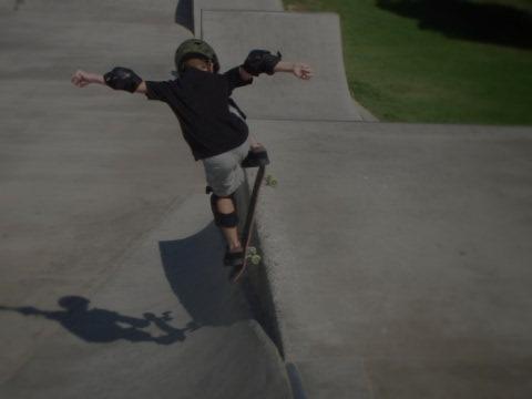 a picture of a boy skating, brighter