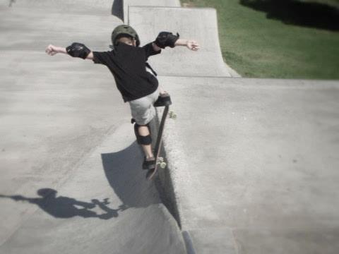 a picture of a boy skating, less color