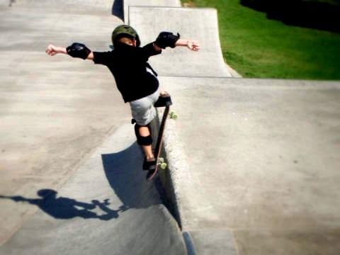 a picture of a boy skating, higher contrast